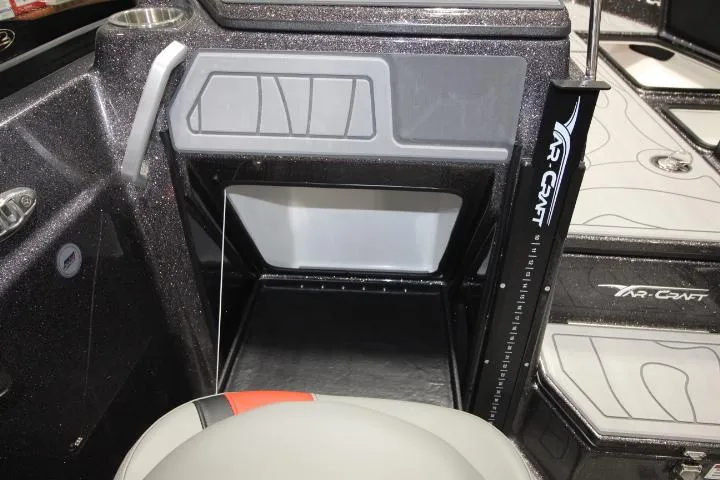 Slide: The Image of 2025 Yar-Craft 210TFX SP boat interior with storage compartment and seating. - 12