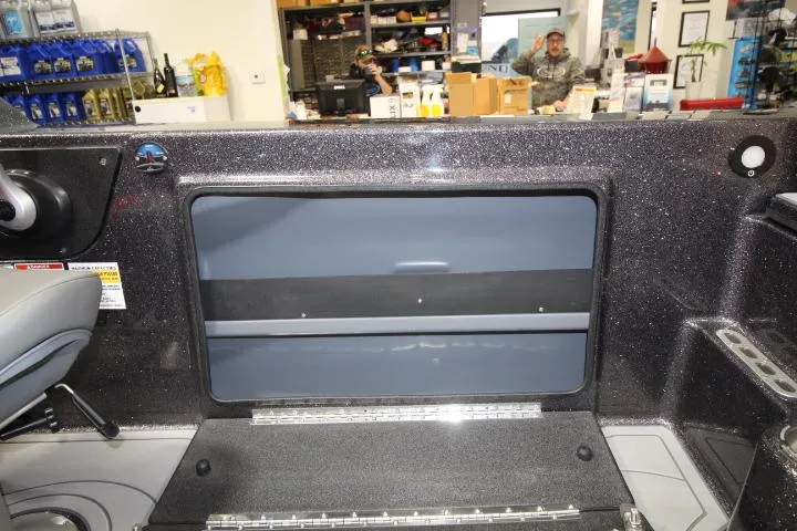 Slide: The Image of 2025 Yar-Craft 210TFX SP boat interior with storage compartment in showroom. - 14