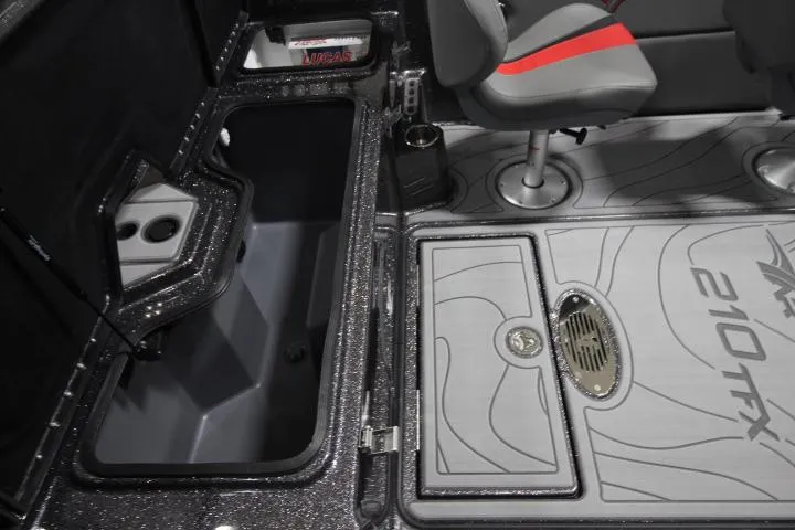 Slide: The Image of 2025 Yar-Craft 210TFX SP boat interior with storage compartment and seating. - 16
