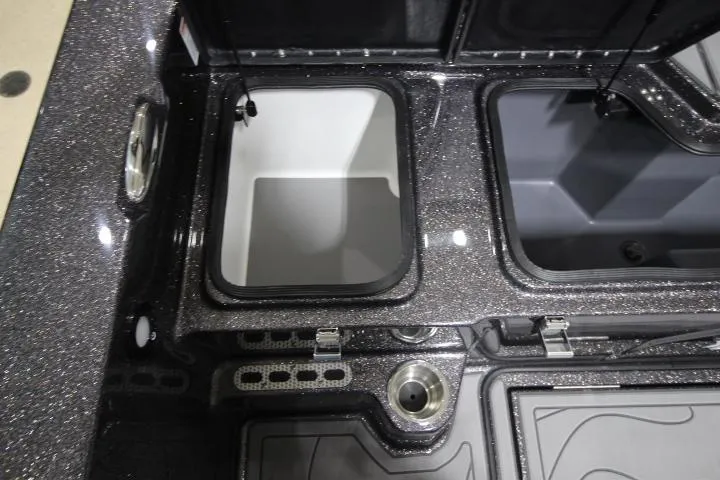 Slide: The Image of 2025 Yar-Craft 210TFX SP boat storage compartments with sleek design and metallic finish. - 17