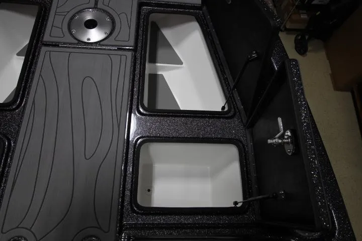 Slide: The Image of 2025 Yar-Craft 210TFX SP boat storage compartments with sleek black finish. - 5