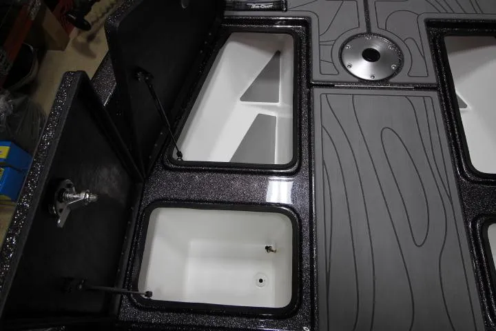 Slide: The Image of 2025 Yar-Craft 210TFX SP boat storage compartments and deck design. - 6