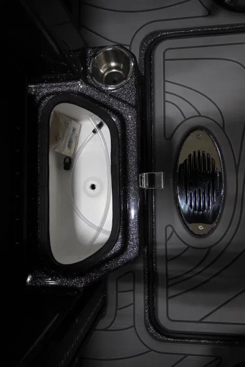 Slide: The Image of 2025 Yar-Craft 210TFX SP boat interior with storage compartment and cup holder. - 8