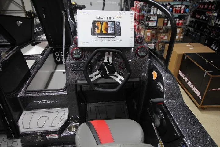 Slide: The Image of 2025 Yar-Craft 210TFX SP boat dashboard with HELIX 9 fish finder display. - 9