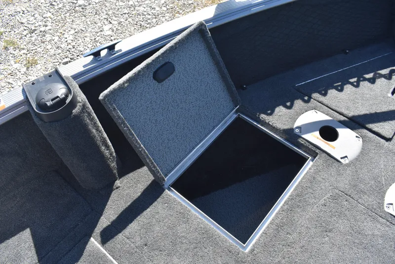 Slide: The Image of 2014 Lund 1675 Impact SS boat interior with open storage compartment. - 14