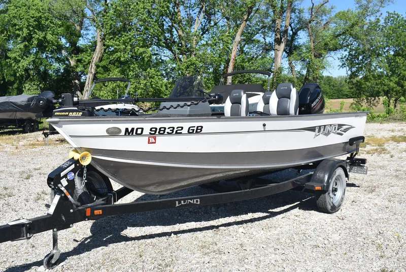 Slide: The Image of 2014 Lund 1675 Impact SS boat on trailer, parked outdoors. - 5