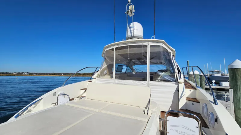 Slide: The Image of Azimut Atlantis 50 yacht, 2015 model, docked with clear blue sky background. - 10