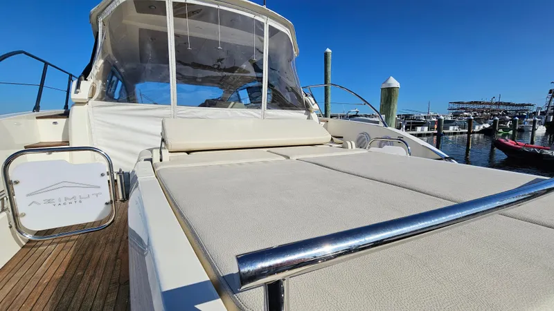 Slide: The Image of Azimut Atlantis 50 yacht, 2015 model, docked with sunbathing area and clear blue sky. - 15