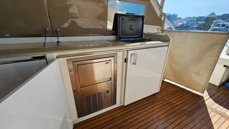 Slide: The Image of Outdoor kitchen area on 2015 Azimut Atlantis 50 yacht with wooden flooring. - 22