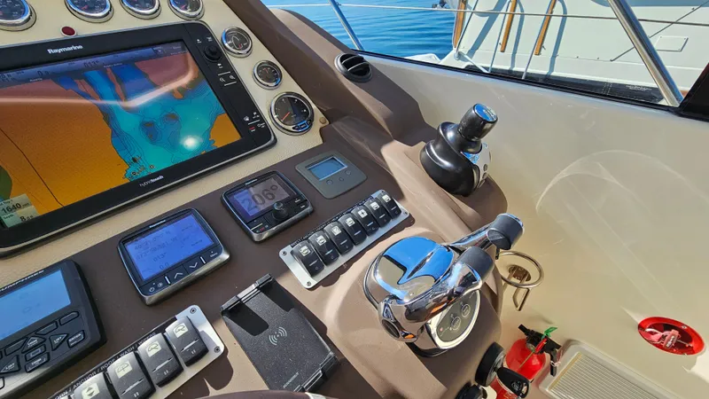 Slide: The Image of Control panel of 2015 Azimut Atlantis 50 yacht with navigation equipment and controls. - 29