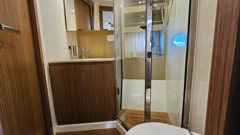 Slide: The Image of Bathroom interior of 2015 Azimut Atlantis 50 yacht with modern fixtures and wood accents. - 44