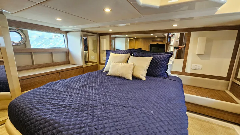 Slide: The Image of Luxurious bedroom interior of 2015 Azimut Atlantis 50 yacht with blue bedding. - 45