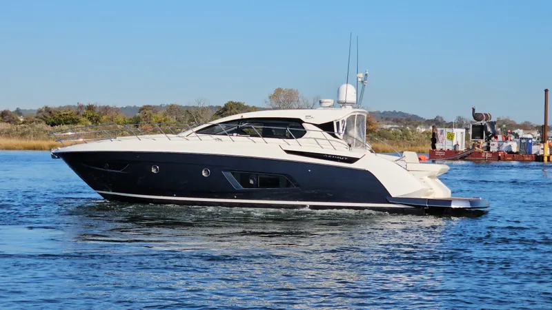 Slide: The Image of Azimut Atlantis 50 yacht, 2015 model, cruising on a calm blue waterway. - 5