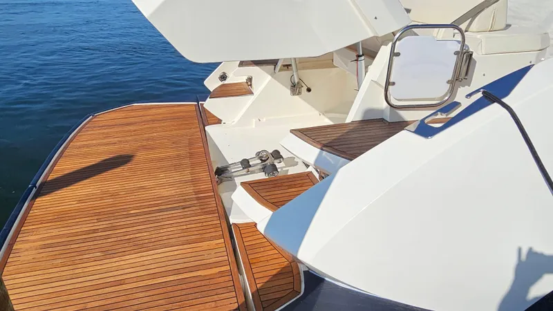 Slide: The Image of Azimut Atlantis 50 yacht, 2015 model, featuring elegant wooden deck and sleek design. - 7