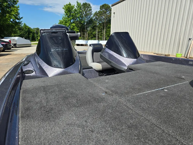 Slide: The Image of 2014 Skeeter ZX 20 boat with dual consoles and spacious deck. - 11