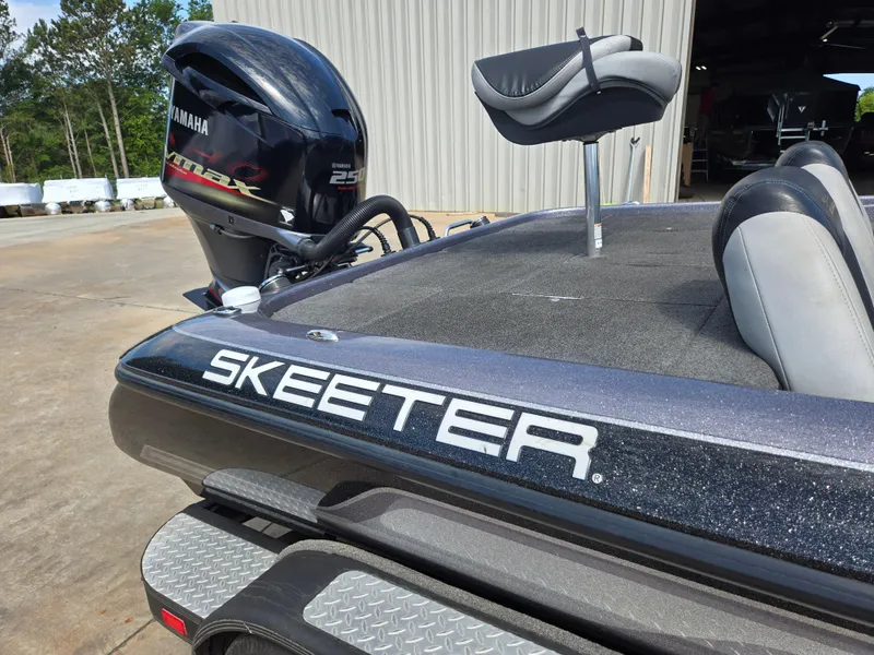 Slide: The Image of 2014 Skeeter ZX 20 boat with Yamaha engine, parked outdoors. - 14