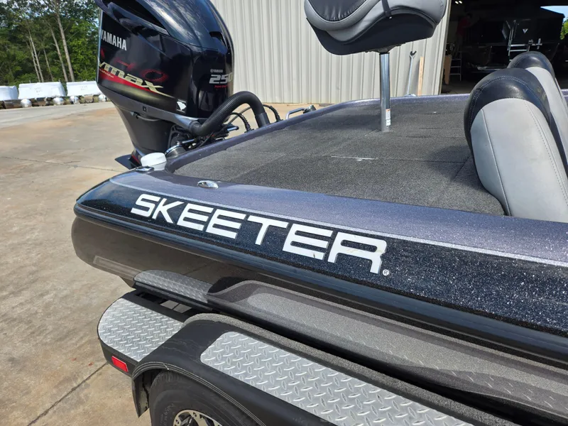 Slide: The Image of 2014 Skeeter ZX 20 boat with Yamaha engine, parked outdoors. - 16
