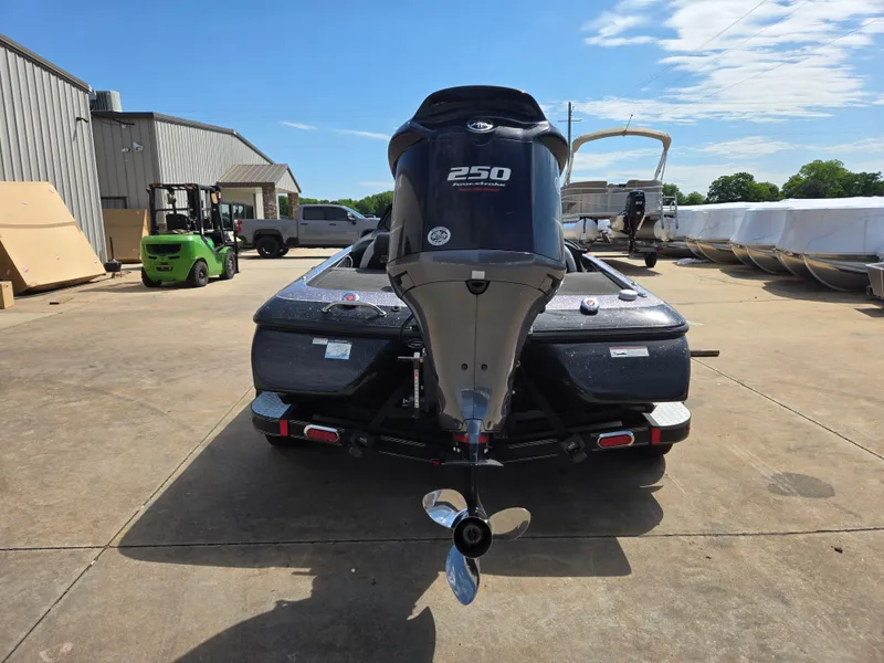 Slide: The Image of 2014 Skeeter ZX 20 boat with 250 HP engine, parked outdoors. - 17