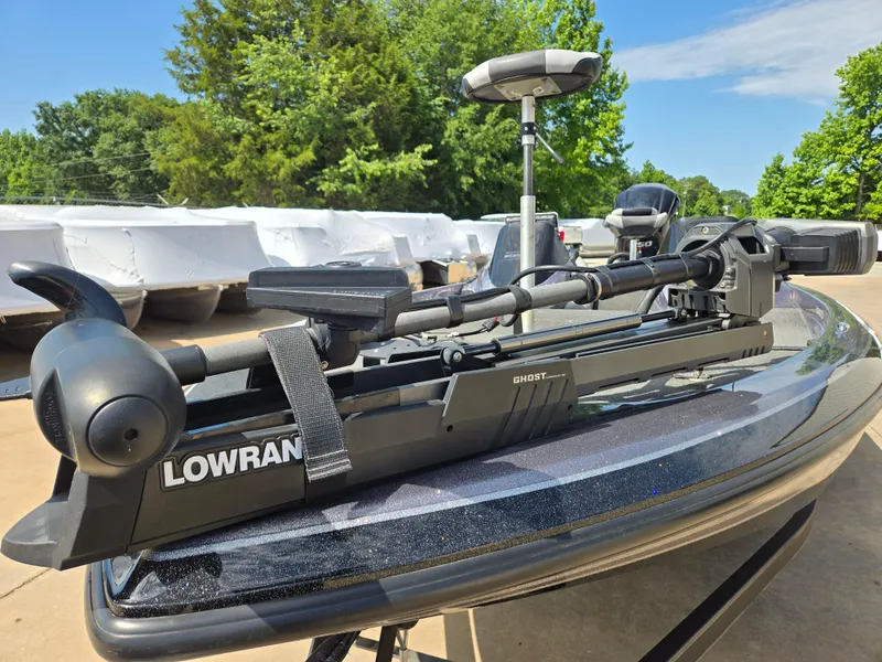 Slide: The Image of 2014 Skeeter ZX 20 boat with Lowrance Ghost trolling motor, outdoors on a sunny day. - 6