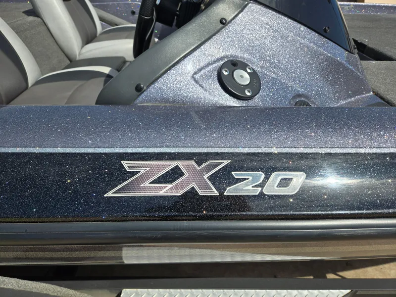 Slide: The Image of 2014 Skeeter ZX 20 boat with metallic finish and logo detail. - 9