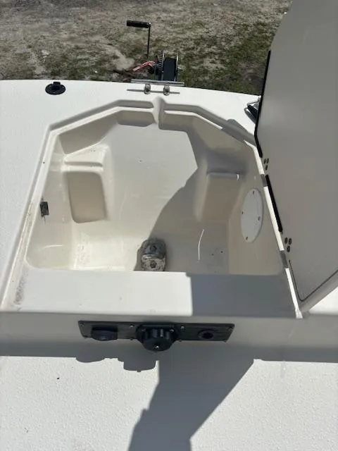 Slide: The Image of 2021 Carolina Skiff 23 LS boat storage compartment with open hatch. - 5