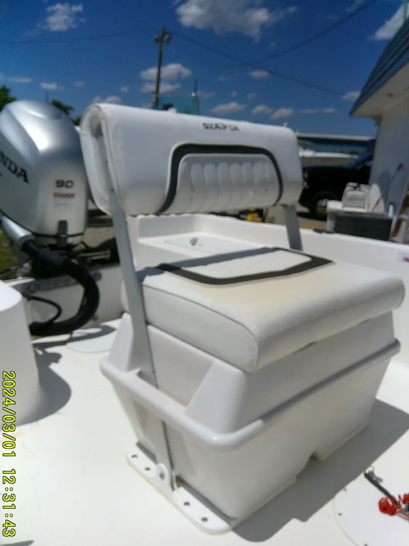 Slide: The Image of 2011 Sea Fox 172 CC boat seat with Honda 90 engine in sunny setting. - 12