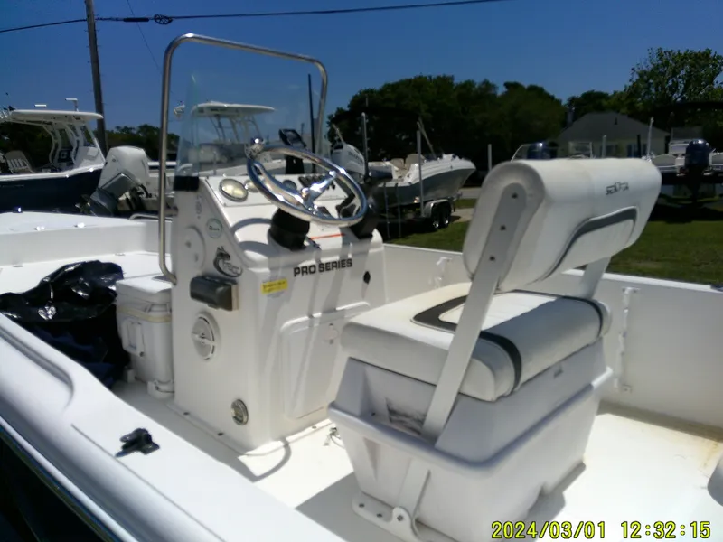 Slide: The Image of 2011 Sea Fox 172 CC boat interior with steering console and seating. - 17