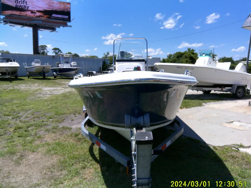 Slide: The Image of 2011 Sea Fox 172 CC boat on trailer under clear blue sky. - 3