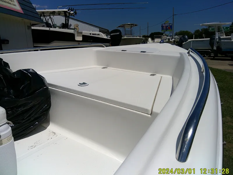 Slide: The Image of 2011 Sea Fox 172 CC boat interior with storage compartment and railing. - 9