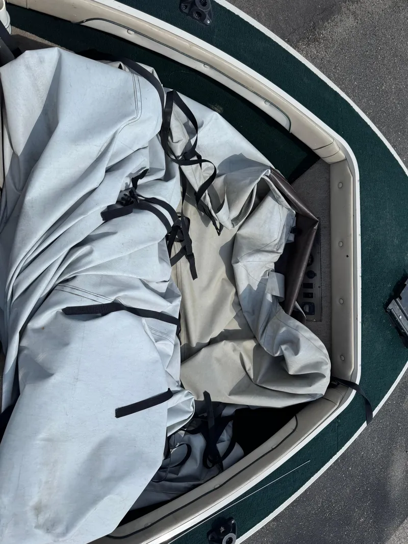 Slide: The Image of 1999 Sylvan 1700 Pro Select boat with cover, interior view. - 9