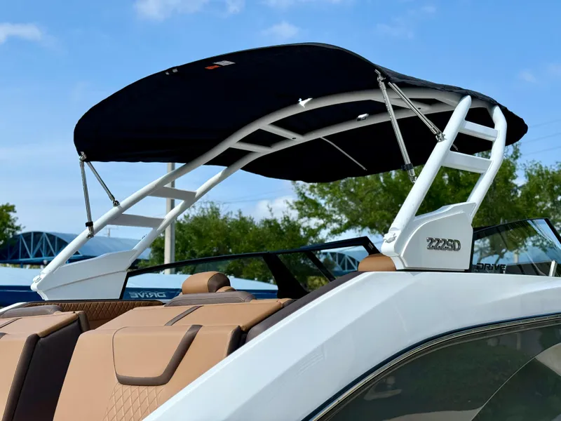 Slide: The Image of 2025 Yamaha Boats 222SD with sleek canopy and modern design. - 12