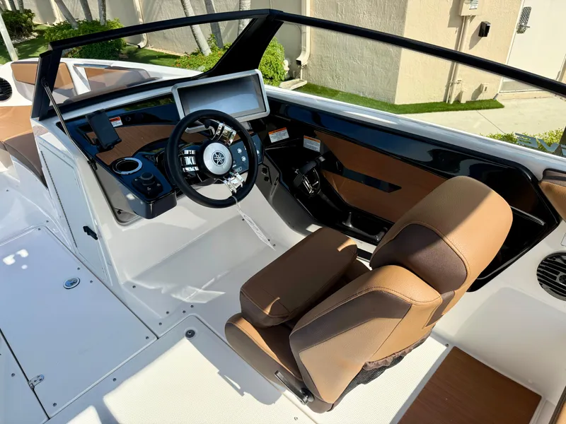Slide: The Image of 2025 Yamaha Boats 222SD cockpit with modern steering and dashboard design. - 14