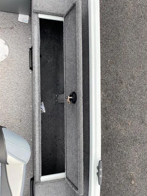 Slide: The Image of 2022 Alumacraft Escape 145 CS boat interior storage compartment. - 7