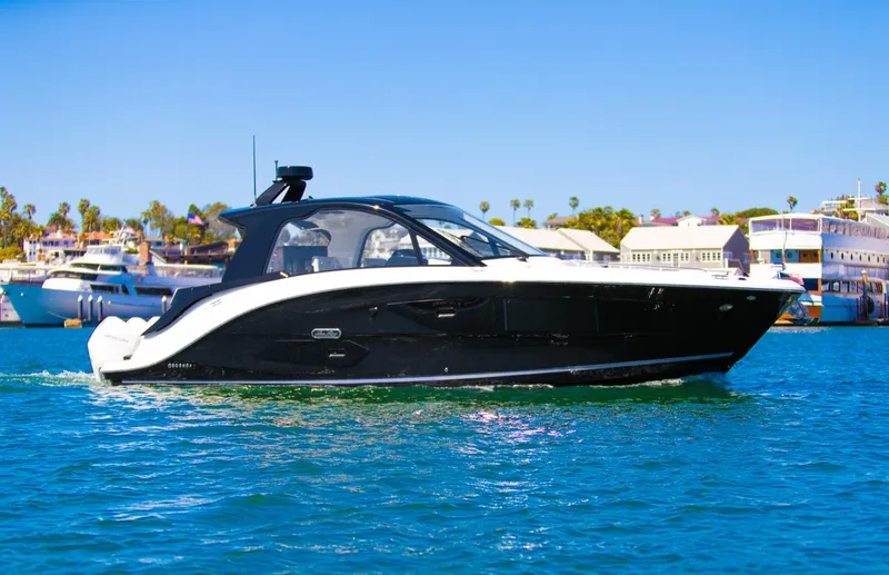 Slide: The Image of 2022 Sea Ray Sundancer 370 OB cruising on a sunny day. - 14