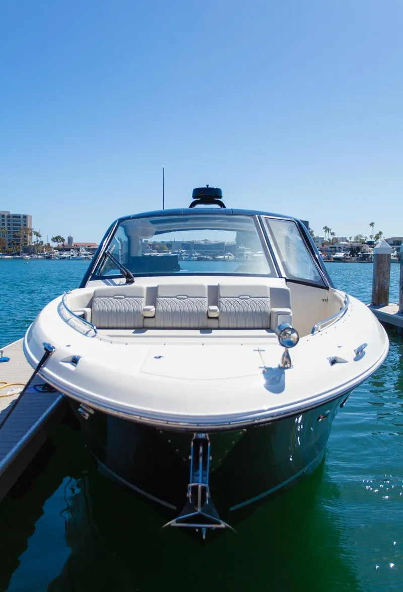 Slide: The Image of 2022 Sea Ray Sundancer 370 OB docked in sunny marina. - 35