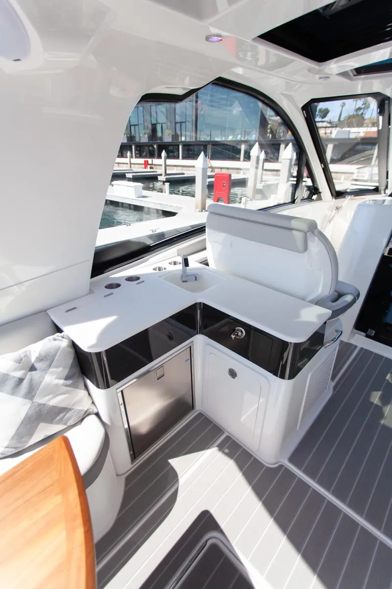 Slide: The Image of 2022 Sea Ray Sundancer 370 OB interior with sleek seating and modern design. - 38