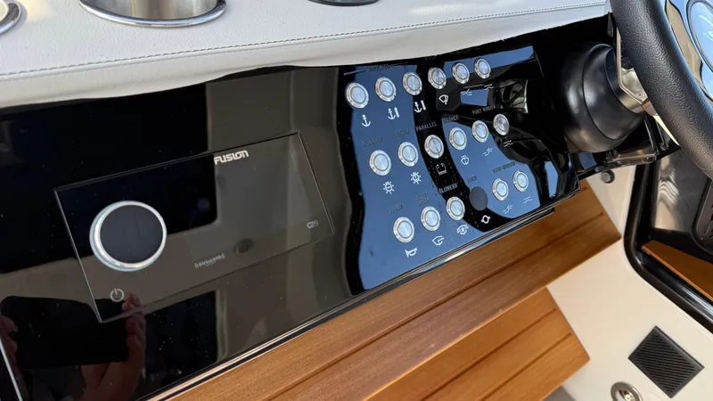 Slide: The Image of Control panel of 2022 Sea Ray Sundancer 370 OB with Fusion audio system. - 40