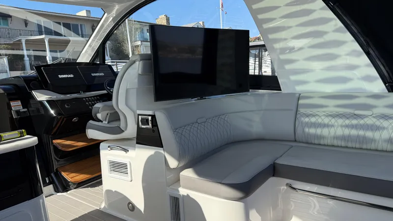 Slide: The Image of Interior of 2022 Sea Ray Sundancer 370 OB with modern seating and TV. - 43
