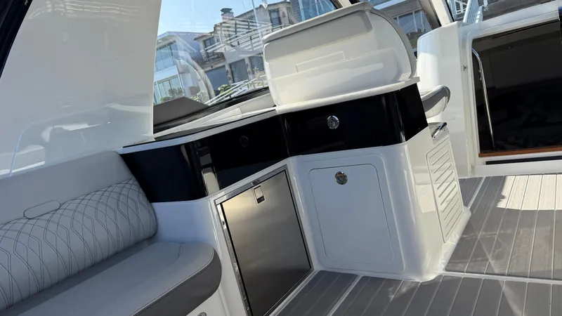 Slide: The Image of 2022 Sea Ray Sundancer 370 OB interior with seating and kitchenette. - 44