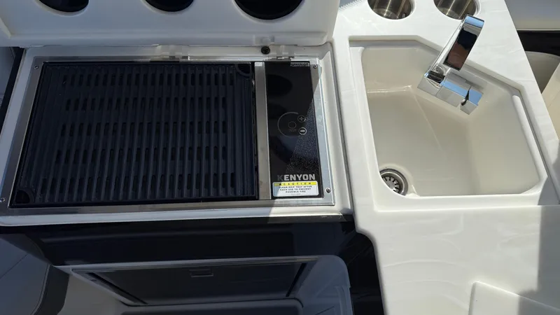 Slide: The Image of Outdoor kitchen on 2022 Sea Ray Sundancer 370 OB with grill and sink. - 45