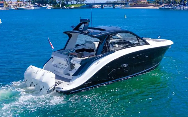 Slide: The Image of 2022 Sea Ray Sundancer 370 OB cruising on a sunny day in a scenic harbor. - 7