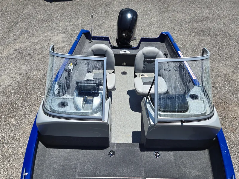 Slide: The Image of 2018 Tracker Pro Guide V-16 WT boat interior with dual windshields and seating. - 10