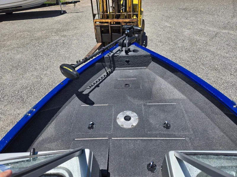 Slide: The Image of 2018 Tracker Pro Guide V-16 WT boat deck with trolling motor, viewed from the cockpit. - 11