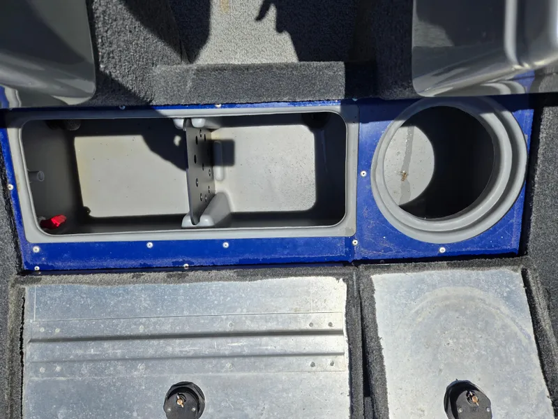 Slide: The Image of 2018 Tracker Pro Guide V-16 WT boat storage compartments and cup holder. - 12