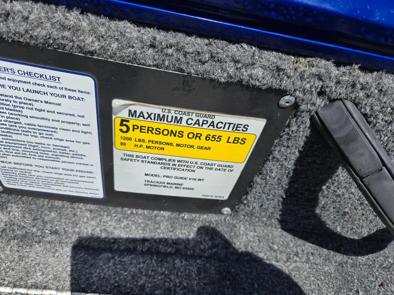 Slide: The Image of 2018 Tracker Pro Guide V-16 WT capacity label: 5 persons or 655 lbs, 1200 lbs total. - 6