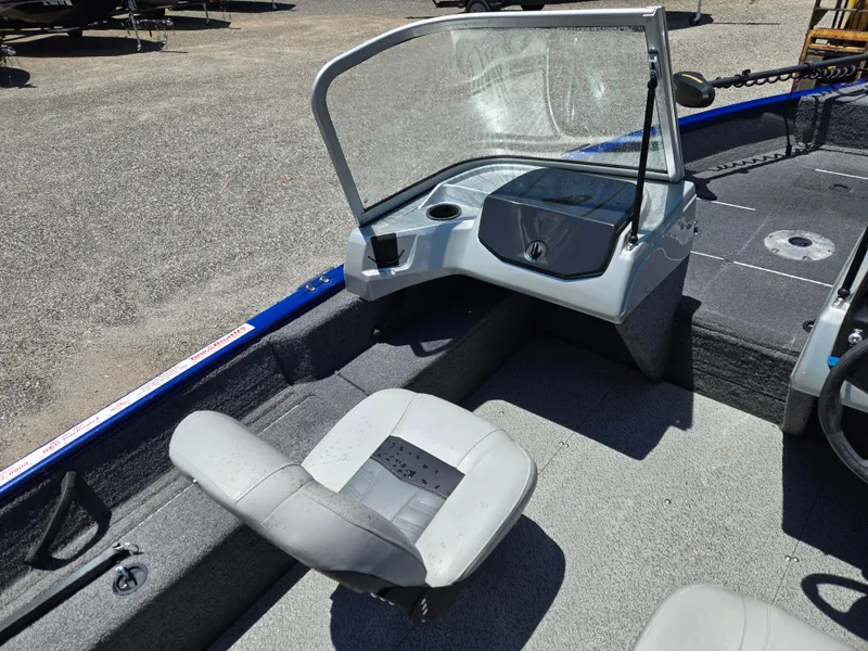 Slide: The Image of 2018 Tracker Pro Guide V-16 WT boat interior with seating and windshield. - 7
