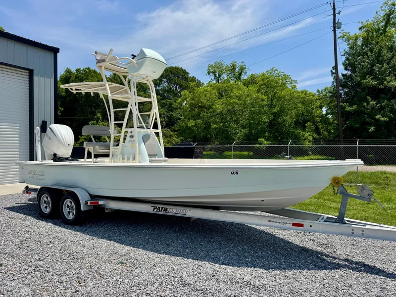 Slide: The Image of 2011 Pathfinder 2400 Tournament Edition boat on trailer, parked outdoors. - 1