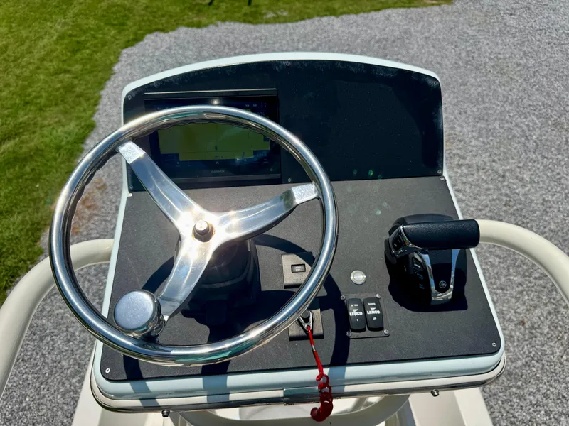 Slide: The Image of Steering console of 2011 Pathfinder 2400 Tournament Edition boat. - 11