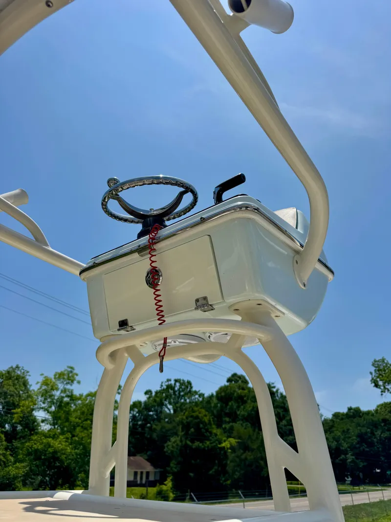 Slide: The Image of 2011 Pathfinder 2400 Tournament Edition boat console under clear blue sky. - 12