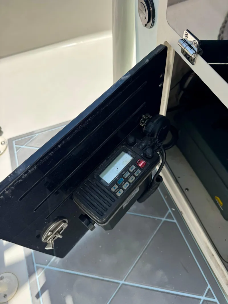 Slide: The Image of VHF radio installed in a 2011 Pathfinder 2400 Tournament Edition boat compartment. - 15
